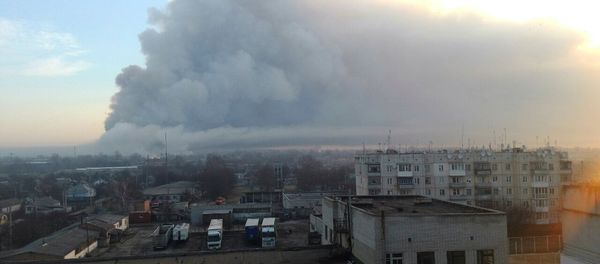 Smoke rises over a warehouse storing tank ammunition at a military base in the town of Balaklia (Balakleya), Kharkiv region, Ukraine - Sputnik International