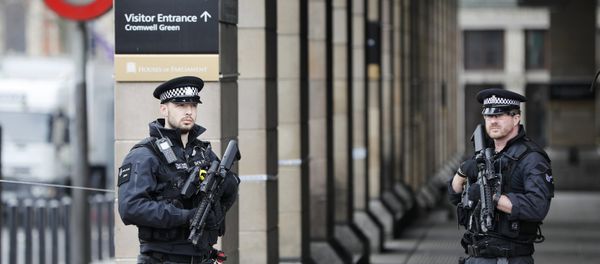 Armed police officers patrol outside Westminster underground station the morning after an attack in London, Britain, March 23, 2017. - Sputnik International