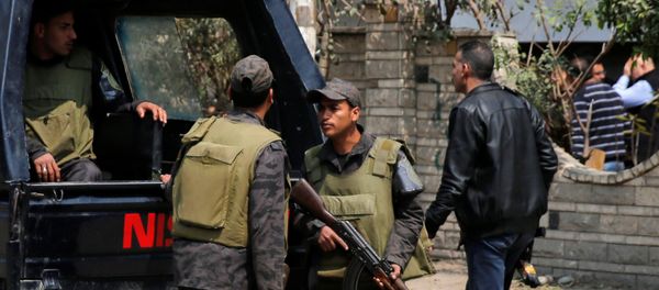 Riot police officers stand guard in front of the wall of a property's garden as security officials inspect the scene of an explosion, where the Interior Ministry said an unidentified metallic object was found, in the Cairo suburb of Maadi, Egypt, March 24, 2017 Riot police officers stand guard in front of the wall of a property's garden as security officials inspect the scene of an explosion, where the Interior Ministry said an unidentified metallic object was found, in the Cairo suburb of Maadi, Egypt, March 24, 2017 - Sputnik International