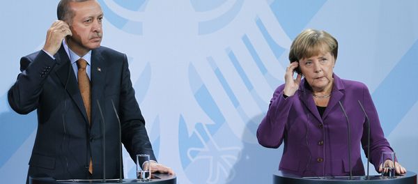 German Chancellor Angela Merkel, right, and Turkey's Prime Minister Recep Tayyip Erdogan, left, address the media during a news conference after a meeting at the Chancellery in Berlin, Germany, Wednesday, Nov. 2, 2011. German Chancellor Angela Merkel, right, and Turkey's Prime Minister Recep Tayyip Erdogan, left, address the media during a news conference after a meeting at the Chancellery in Berlin, Germany, Wednesday, Nov. 2, 2011. - Sputnik International