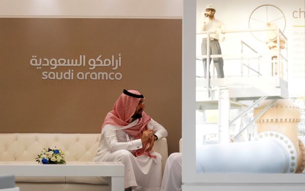 A Saudi Aramco employee sits in the area of its stand at the Middle East Petrotech 2016, an exhibition and conference for the refining and petrochemical industries, in Manama, Bahrain, September 27, 2016. A Saudi Aramco employee sits in the area of its stand at the Middle East Petrotech 2016, an exhibition and conference for the refining and petrochemical industries, in Manama, Bahrain, September 27, 2016. - Sputnik International