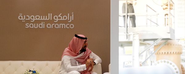 A Saudi Aramco employee sits in the area of its stand at the Middle East Petrotech 2016, an exhibition and conference for the refining and petrochemical industries, in Manama, Bahrain, September 27, 2016. - Sputnik International
