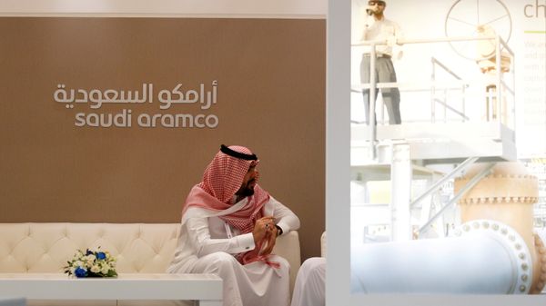 A Saudi Aramco employee sits in the area of its stand at the Middle East Petrotech 2016, an exhibition and conference for the refining and petrochemical industries, in Manama, Bahrain, September 27, 2016. - Sputnik International