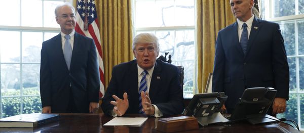 President Donald Trump, flanked by Health and Human Services Secretary Tom Price, left, and Vice President Mike Pence, meets with members of the media regarding the health care overhaul bill, Friday, March 24, 2017, in the Oval Office of the White House in Washington. President Donald Trump, flanked by Health and Human Services Secretary Tom Price, left, and Vice President Mike Pence, meets with members of the media regarding the health care overhaul bill, Friday, March 24, 2017, in the Oval Office of the White House in Washington. - Sputnik International