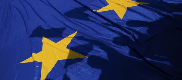 Protestors cast their shadows over an European flag during a pro-EU demonstration as European Union leaders meet in downtown Rome, Italy, March 25, 2017 Protestors cast their shadows over an European flag during a pro-EU demonstration as European Union leaders meet in downtown Rome, Italy, March 25, 2017 - Sputnik International