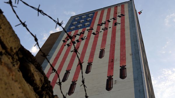 Graffiti with anti-US slogan is seen decorating the wall of a building in Tehran on July 14, 2015 Graffiti with anti-US slogan is seen decorating the wall of a building in Tehran on July 14, 2015 - Sputnik International