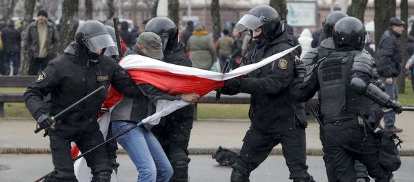 Belarus police detain a protester with an opposition flag during an opposition rally in Minsk, Belarus, Saturday, March 25, 2017 Belarus police detain a protester with an opposition flag during an opposition rally in Minsk, Belarus, Saturday, March 25, 2017 - Sputnik International