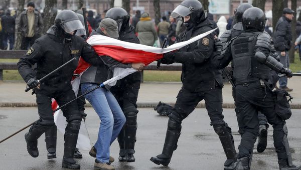 Belarus police detain a protester with an opposition flag during an opposition rally in Minsk, Belarus, Saturday, March 25, 2017 Belarus police detain a protester with an opposition flag during an opposition rally in Minsk, Belarus, Saturday, March 25, 2017 - Sputnik International