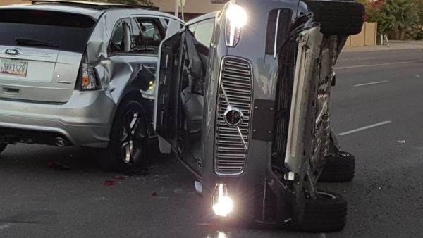 A self-driven Volvo SUV owned and operated by Uber Technologies Inc. is flipped on its side after a collision in Tempe, Arizona, U.S. on March 24, 2017. - Sputnik International