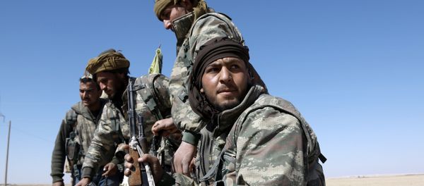 US-backed Syrian Democratic Forces (SDF), made up of an alliance of Arab and Kurdish fighters, advance in the village of Sabah al-Khayr on the northern outskirts of Deir Ezzor as they drive to encircle the Islamic State (IS) group bastion of Raqa on February 21, 2017 US-backed Syrian Democratic Forces (SDF), made up of an alliance of Arab and Kurdish fighters, advance in the village of Sabah al-Khayr on the northern outskirts of Deir Ezzor as they drive to encircle the Islamic State (IS) group bastion of Raqa on February 21, 2017 - Sputnik International