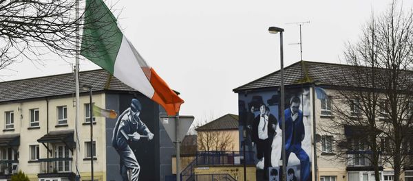 The Irish flag flies at half-mast after the death of Martin McGuinness, in the Bogside area of Londonderry, Northern Ireland, March 21, 2017. The Irish flag flies at half-mast after the death of Martin McGuinness, in the Bogside area of Londonderry, Northern Ireland, March 21, 2017. - Sputnik International
