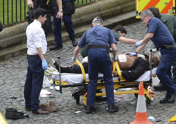 FILE- In this March 22, 2017 file photo, the attacker Khalid Masood is treated by emergency services outside the Houses of Parliament London. British Police named on Thursday March 23, 2017, Khalid Masood as The Houses of Parliament attacker - Sputnik International
