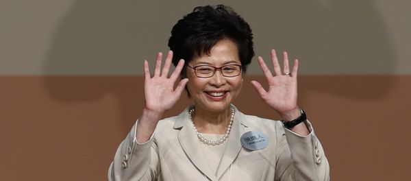 Former Hong Kong Chief Secretary Carrie Lam waves as she declares her victory in the chief executive election of Hong Kong in Hong Kong - Sputnik International