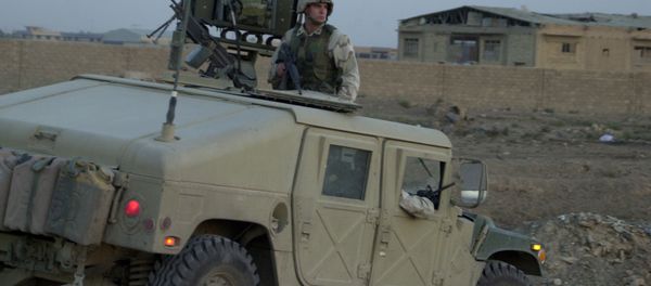 US soldier sits on top of a Humvee - Sputnik International