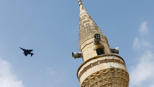 A Turkish Air Force F-4 fighter jet flies over a minaret after it took off from Incirlik air base in Adana, Turkey, August 12, 2015. A Turkish Air Force F-4 fighter jet flies over a minaret after it took off from Incirlik air base in Adana, Turkey, August 12, 2015. - Sputnik International