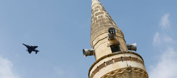 A Turkish Air Force F-4 fighter jet flies over a minaret after it took off from Incirlik air base in Adana, Turkey, August 12, 2015. A Turkish Air Force F-4 fighter jet flies over a minaret after it took off from Incirlik air base in Adana, Turkey, August 12, 2015. - Sputnik International