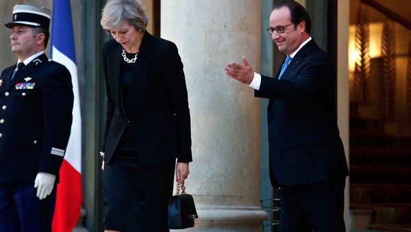 France's President Francois Hollande gestures as Britain's Prime Minister Theresa May leaves the Elysee Palace, in Paris, Thursday, July 21, 2016. France's President Francois Hollande gestures as Britain's Prime Minister Theresa May leaves the Elysee Palace, in Paris, Thursday, July 21, 2016. - Sputnik International