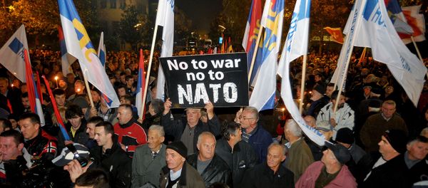 An opposition supporter holds a banner that reads No to war - no to NATO during protest in downtown Podgorica, Montenegro, Saturday, Dec. 12, 2015 An opposition supporter holds a banner that reads No to war - no to NATO during protest in downtown Podgorica, Montenegro, Saturday, Dec. 12, 2015 - Sputnik International