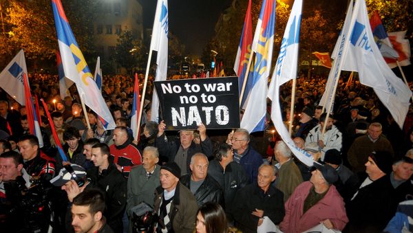 An opposition supporter holds a banner that reads No to war - no to NATO during protest in downtown Podgorica, Montenegro, Saturday, Dec. 12, 2015 An opposition supporter holds a banner that reads No to war - no to NATO during protest in downtown Podgorica, Montenegro, Saturday, Dec. 12, 2015 - Sputnik International