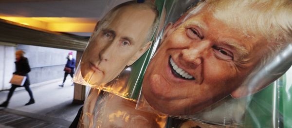 In this Monday, Feb. 20, 2017 photo face masks depicting Russian President Vladimir Putin and US President Donald Trump hang on sale at a souvenir street shop in St.Petersburg, Russia - Sputnik International