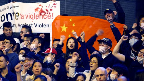 Members of the Chinese community shout slogans during a protest at Place de la Bastille in Paris, France, March 30, 2017 Members of the Chinese community shout slogans during a protest at Place de la Bastille in Paris, France, March 30, 2017 - Sputnik International