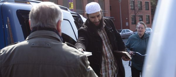 A member of a Muslim group distributes copies of the Quran at Potsdamer Platz in Berlin (File) A member of a Muslim group distributes copies of the Quran at Potsdamer Platz in Berlin (File) - Sputnik International