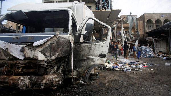 A damaged vehicle is seen at the site of car bomb attack in the Amil neighborhood in Baghdad, Iraq March 21, 2017 A damaged vehicle is seen at the site of car bomb attack in the Amil neighborhood in Baghdad, Iraq March 21, 2017 - Sputnik International