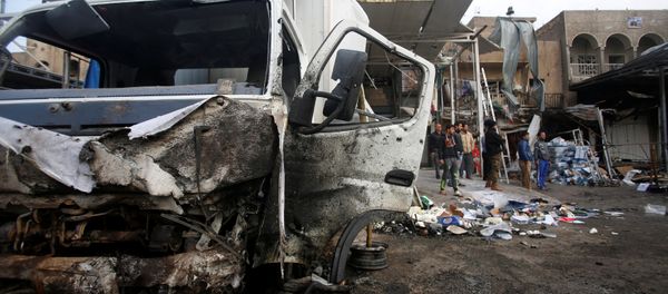 A damaged vehicle is seen at the site of car bomb attack in the Amil neighborhood in Baghdad, Iraq March 21, 2017 A damaged vehicle is seen at the site of car bomb attack in the Amil neighborhood in Baghdad, Iraq March 21, 2017 - Sputnik International