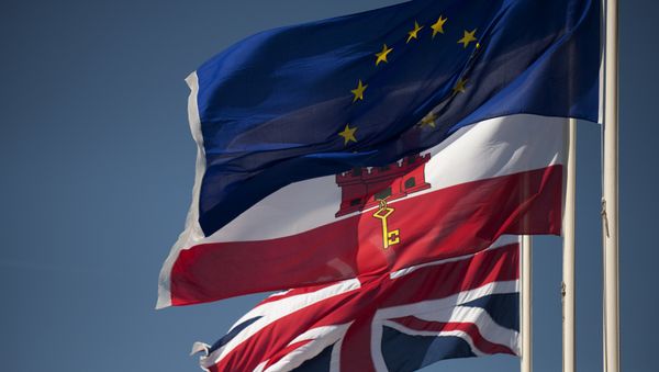 A Union Jack flag (Down), the flag of Gibraltar (C) and the European Union flag fly in Gibraltar on March 28, 2017 A Union Jack flag (Down), the flag of Gibraltar (C) and the European Union flag fly in Gibraltar on March 28, 2017 - Sputnik International