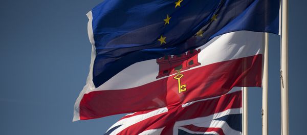 A Union Jack flag (Down), the flag of Gibraltar (C) and the European Union flag fly in Gibraltar on March 28, 2017 A Union Jack flag (Down), the flag of Gibraltar (C) and the European Union flag fly in Gibraltar on March 28, 2017 - Sputnik International