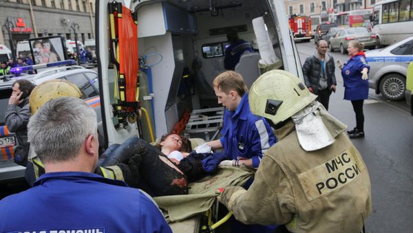 An injured person is helped by emergency services outside Sennaya Ploshchad metro station, following explosions in two train carriages at metro stations in St. Petersburg, Russia April 3, 2017 An injured person is helped by emergency services outside Sennaya Ploshchad metro station, following explosions in two train carriages at metro stations in St. Petersburg, Russia April 3, 2017 - Sputnik International