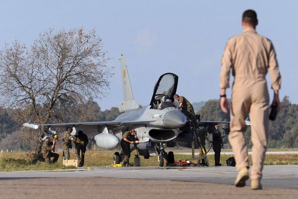 A Belgian pilot walks toward his F-16 fighter jet at Araxos airport in Kato Ahaia, Greece on Monday, March 28, 2011. A Belgian pilot walks toward his F-16 fighter jet at Araxos airport in Kato Ahaia, Greece on Monday, March 28, 2011. - Sputnik International