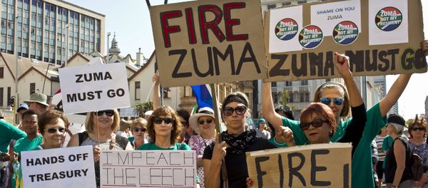 Protestors hold up placards reading 'Fire Zuma' during a demonstration of supporters of the Save South Africa (SaveSA) campaign, civil society organisations and political parties demanding South African President Jacob Zuma to resign on April 4, 2017 in Port Elizabeth, South Africa Protestors hold up placards reading 'Fire Zuma' during a demonstration of supporters of the Save South Africa (SaveSA) campaign, civil society organisations and political parties demanding South African President Jacob Zuma to resign on April 4, 2017 in Port Elizabeth, South Africa - Sputnik International