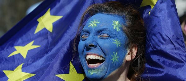 A demonstrator with her face painted in the colours of the EU flag A demonstrator with her face painted in the colours of the EU flag - Sputnik International