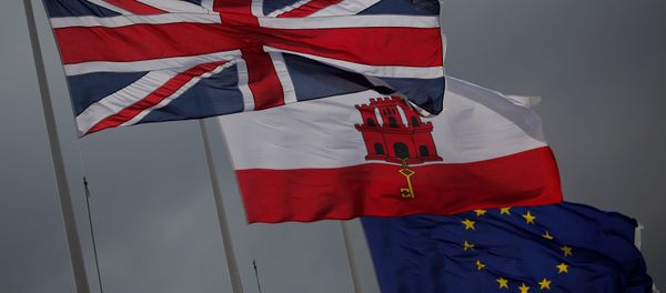 The Union Jack (L), the Gibraltarian flag (C) and the European Union flag are seen flying at the border of Gibraltar with Spain, in the British overseas territory of Gibraltar, historically claimed by Spain April 3, 2017. The Union Jack (L), the Gibraltarian flag (C) and the European Union flag are seen flying at the border of Gibraltar with Spain, in the British overseas territory of Gibraltar, historically claimed by Spain April 3, 2017. - Sputnik International