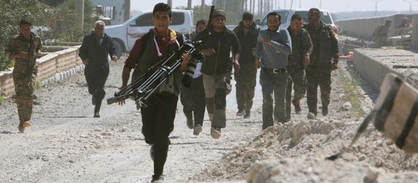Engineers, journalists and Syrian Democratic Forces (SDF) fighters run for cover after Islamic State shelled positions held by the SDF at the Tabqa Dam on the Euphrates River, Syria - Sputnik International