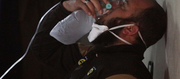 A civil defence member breathes through an oxygen mask, after what rescue workers described as a suspected gas attack in the town of Khan Sheikhoun in rebel-held Idlib, Syria April 4, 2017. A civil defence member breathes through an oxygen mask, after what rescue workers described as a suspected gas attack in the town of Khan Sheikhoun in rebel-held Idlib, Syria April 4, 2017. - Sputnik International