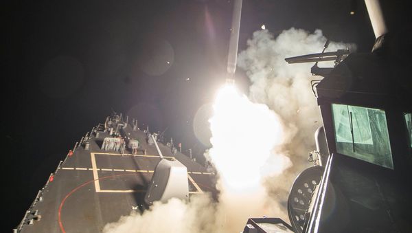 U.S. Navy guided-missile destroyer USS Ross (DDG 71) fires a tomahawk land attack missile in Mediterranean Sea which U.S. Defense Department said was a part of cruise missile strike against Syria on April 7, 2017. - Sputnik International