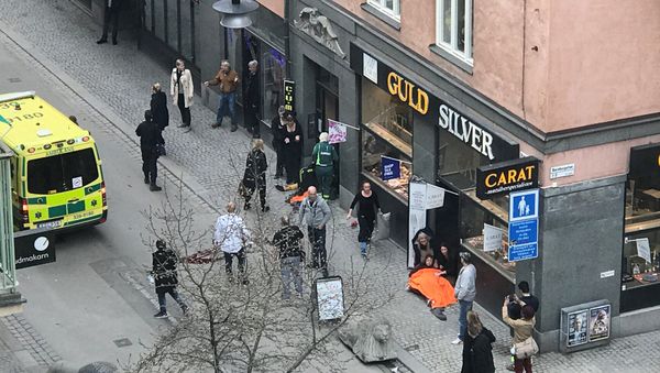 Ambulance in a street near the site were a truck was driven into a crowd in central Stockholm, Sweden Ambulance in a street near the site were a truck was driven into a crowd in central Stockholm, Sweden - Sputnik International