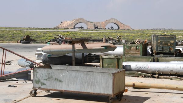 Aftermath of the US missile attack on a Syrian military airbase Aftermath of the US missile attack on a Syrian military airbase - Sputnik International