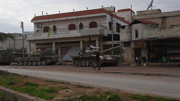 Armored vehicles in a village in the north of Hama, Syria - Sputnik International