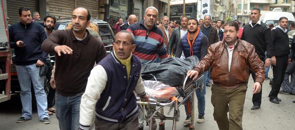 Egyptians wheel away a body near a church in Alexandria after a bomb blast struck worshippers gathering to celebrate Palm Sunday on April 9, 2017 Egyptians wheel away a body near a church in Alexandria after a bomb blast struck worshippers gathering to celebrate Palm Sunday on April 9, 2017 - Sputnik International