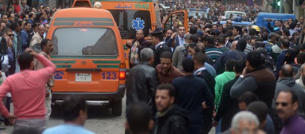 Egyptians look at the scene around ambulances after a suicide bombing in front of a church in Alexandria, Egypt, April 9, 2017 Egyptians look at the scene around ambulances after a suicide bombing in front of a church in Alexandria, Egypt, April 9, 2017 - Sputnik International