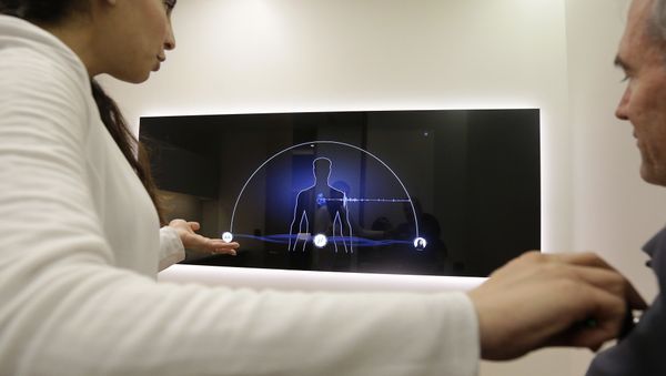 In this Jan. 10, 2017 photo, Dr. Aaliya Yaqub, left, gestures toward a large monitor while giving a demonstration of medical checkup - Sputnik International