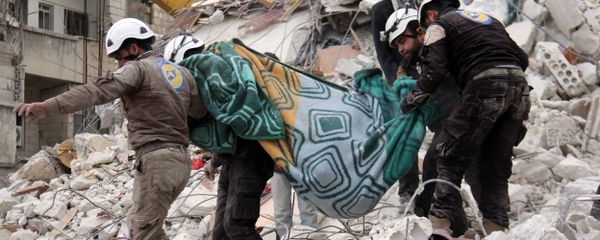 Syrian civil defence volunteers, known as the White Helmets, carry a body retrieved from the rubble following reported government airstrike on the Syrian town of Ariha, in the northwestern province of Idlib, on February 27, 2017 Syrian civil defence volunteers, known as the White Helmets, carry a body retrieved from the rubble following reported government airstrike on the Syrian town of Ariha, in the northwestern province of Idlib, on February 27, 2017 - Sputnik International
