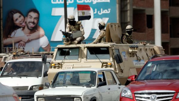 Army soldiers patrol on the Cairo-Alexandria desert road before the funeral of victims of the Palm Sunday bombings of Egyptian Coptic churches, in Cairo, Egypt April 10, 2017 Army soldiers patrol on the Cairo-Alexandria desert road before the funeral of victims of the Palm Sunday bombings of Egyptian Coptic churches, in Cairo, Egypt April 10, 2017 - Sputnik International
