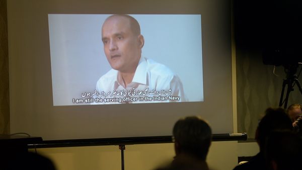 In this photograph taken on March 29, 2016, Pakistani journalists watch a video showing Indian national Kulbhushan Yadav, arrested on suspicion of spying, during a press conference in Islamabad In this photograph taken on March 29, 2016, Pakistani journalists watch a video showing Indian national Kulbhushan Yadav, arrested on suspicion of spying, during a press conference in Islamabad - Sputnik International