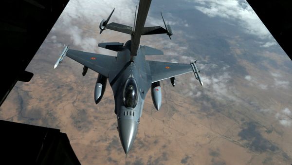 A US Air Force F-16 receives fuel from a fuel boom suspended from a US Air Force KC-10 Extender during mid-air refueling support to Operation Inherent Resolve over Iraq and Syria air space, March 15, 2017 A US Air Force F-16 receives fuel from a fuel boom suspended from a US Air Force KC-10 Extender during mid-air refueling support to Operation Inherent Resolve over Iraq and Syria air space, March 15, 2017 - Sputnik International