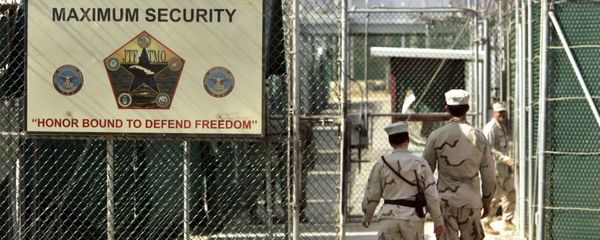 US military guards walk within Camp Delta military-run prison, at the Guantanamo Bay US Naval Base, Cuba. - Sputnik International
