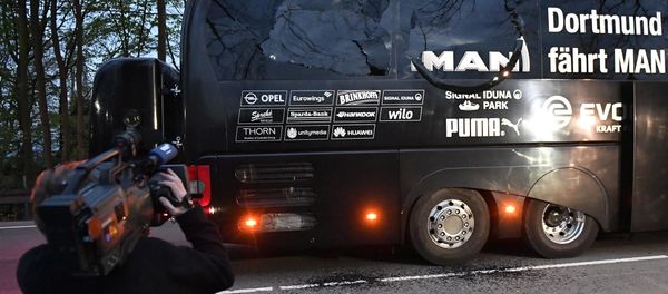 A camera man films Dortmund's team bus after it was damaged in an explosion before the Champions League quarterfinal soccer match between Borussia Dortmund and AS Monaco in Dortmund, western Germany, Tuesday, April 11, 2017. - Sputnik International